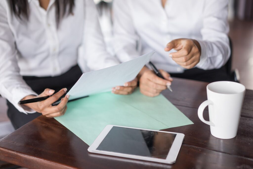 Two people reviewing trust documentation