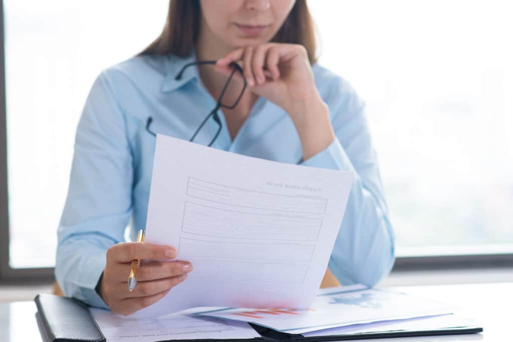 Woman Reading Legal Will Requirements