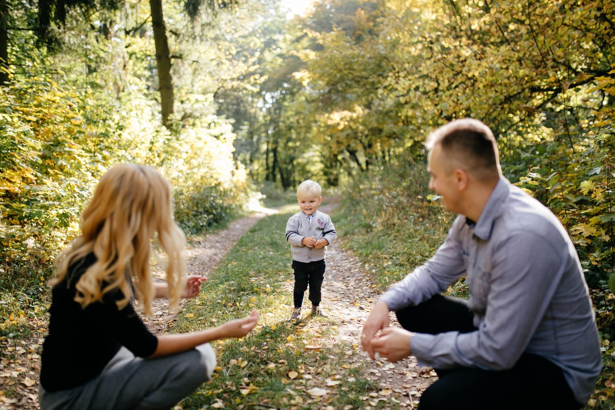 Child with parents at the park